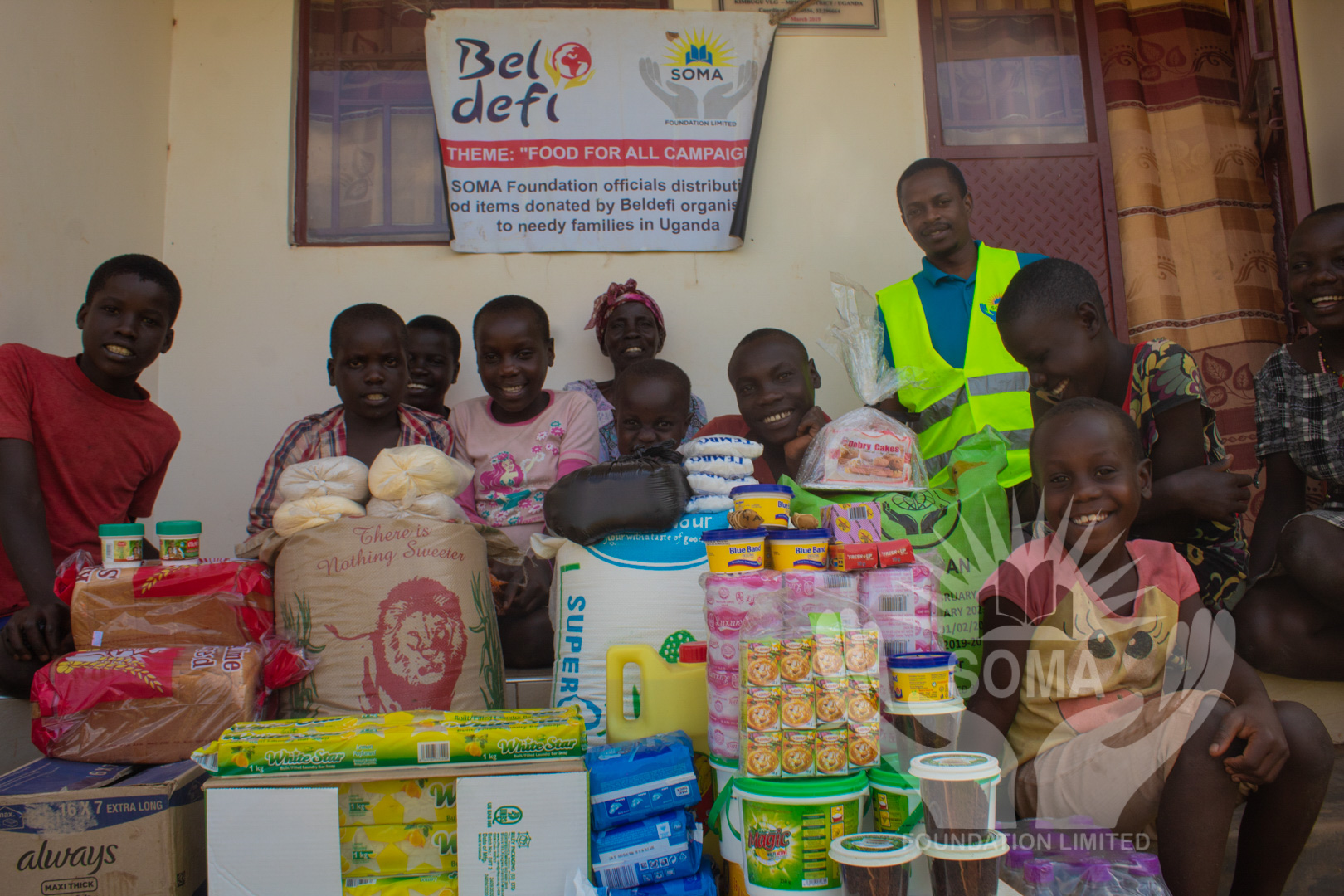 a family posing with food stuff